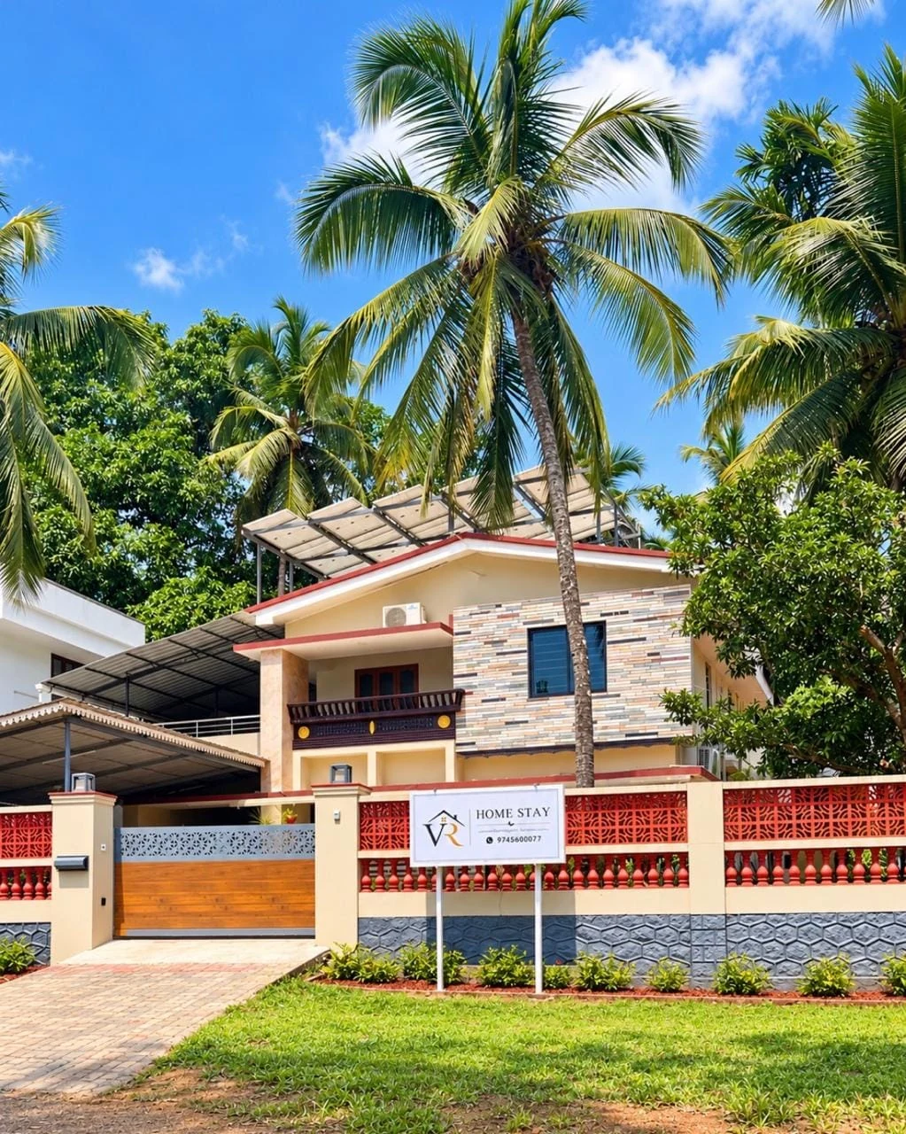 VR Home Stay frontage framed by coconut palms