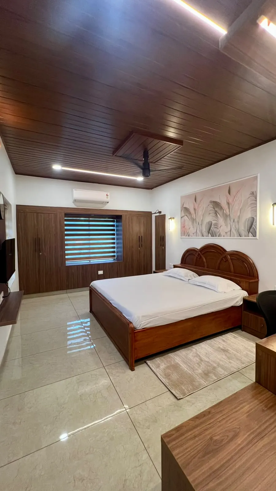 Walnut ceiling with linear lighting