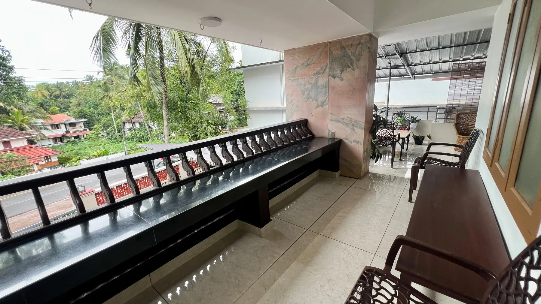 Long covered verandah overlooking the palms